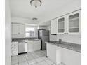 Bright eat-in kitchen, granite countertops, stainless steel appliances at 4430 Floramar Ter, New Port Richey, FL 34652
