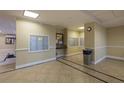 Condo lobby with mailboxes, a notice board, and a trash receptacle at 4516 Seagull Dr # 417, New Port Richey, FL 34652