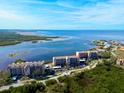 Aerial view of waterfront condo building showcasing its location at 4620 Bay Blvd # 1158, Port Richey, FL 34668