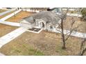 Single-story house with driveway and fenced yard at 12312 Millington Ave, Weeki Wachee, FL 34614