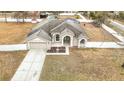 One-story house with a large yard and driveway at 12312 Millington Ave, Weeki Wachee, FL 34614