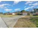 Single-story home with a long driveway at 1318 Altoona Ave, Spring Hill, FL 34609