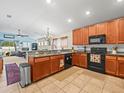 Modern kitchen with granite countertops and ample cabinet space at 14284 Finsbury Dr, Spring Hill, FL 34609