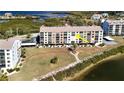 Waterfront condo building showcasing a unit with a large balcony at 4620 Bay Blvd # 1145, Port Richey, FL 34668