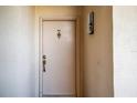 Condo entry door with brass door knocker and address number 1145 at 4620 Bay Blvd # 1145, Port Richey, FL 34668