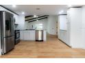 Modern kitchen featuring stainless steel appliances and granite countertops at 4852 Capron St, New Port Richey, FL 34653