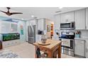 Bright kitchen with stainless steel appliances and an island at 4907 Floramar Ter, New Port Richey, FL 34652