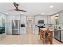 Spacious kitchen featuring stainless steel appliances and an island at 4907 Floramar Ter, New Port Richey, FL 34652