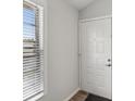 Entryway with white door and window with blinds at 6428 Gloria Dr # 26, New Port Richey, FL 34653