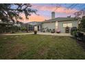 Spacious backyard oasis with a screened-in pool and patio at 8831 Bel Meadow Way, Trinity, FL 34655
