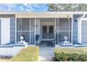 Enclosed porch with seating area, perfect for relaxing outdoors at 11030 Linkside Dr # 11030, Port Richey, FL 34668