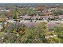 Wide shot of houses with a tree-lined walkway, showcasing the community's landscape at 1392 Summerwood Ct, Spring Hill, FL 34606