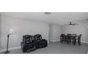 Dining area with table and six chairs, ceiling fan at 6166 Newmark St, Spring Hill, FL 34606
