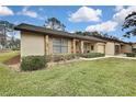 Low-maintenance exterior with stone and vinyl siding at 7267 Prince George Ct, Spring Hill, FL 34606