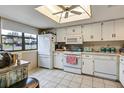 Bright kitchen featuring white appliances and ample counter space at 8210 Sulky Ct # 5, Port Richey, FL 34668