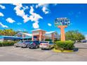 Anna Maria Oyster Bar; building exterior with parking lot and signage at 10135 Zennia Ln, Parrish, FL 34219
