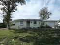 Ranch style home with a large yard and mature tree at 13737 Michelle Ave, Hudson, FL 34667