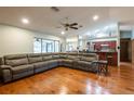 Open concept living room with hardwood floors and view of kitchen at 1378 Haulover Ave, Spring Hill, FL 34608
