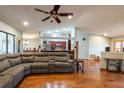 Open concept living room with hardwood floors and kitchen access at 1378 Haulover Ave, Spring Hill, FL 34608