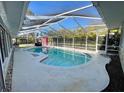 Inviting screened-in pool area at 1624 Sea Breeze Dr, Tarpon Springs, FL 34689