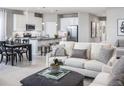 Open concept kitchen with an island and stainless steel appliances at 2463 White Ladyfish Rd, Wimauma, FL 33598
