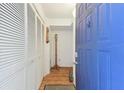 Bright entryway with built-in storage and hardwood floors at 5557 Sea Forest Dr # 117, New Port Richey, FL 34652