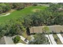 Aerial view of the community, highlighting its proximity to a golf course at 7384 Prince George Ct, Spring Hill, FL 34606