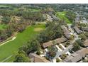 Wide aerial showcasing the community near a golf course at 7384 Prince George Ct, Spring Hill, FL 34606