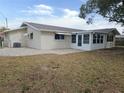 Home with a patio and screened-in sunroom at 7538 Bougenville Dr, Port Richey, FL 34668