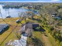 Aerial view of a waterfront property with lush greenery at 18104 Spencer Rd, Odessa, FL 33556