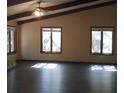 Spacious living room featuring hardwood floors and large windows at 18623 Firethorn Dr, Spring Hill, FL 34610