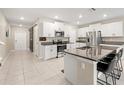Spacious kitchen with an island and stainless steel appliances at 194 Argyll Dr, Spring Hill, FL 34609