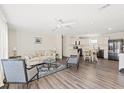 Living room features hardwood floors, neutral walls and a comfy sofa at 3323 Parlow Ave, Spring Hill, FL 34606
