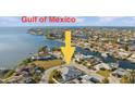 Aerial view showing home's location on a canal, close to the Gulf of Mexico at 3912 Rudder Way, New Port Richey, FL 34652