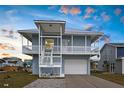 Charming coastal home with a spacious covered porch, perfect for enjoying outdoor living at 4045 Centavo Ct, Hernando Beach, FL 34607