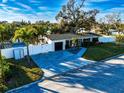 Modern home with a spacious backyard and a long driveway at 4292 Maple Ne St, St Petersburg, FL 33703