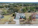 Aerial view showcasing the house, backyard, and neighborhood at 4438 Crescent Rd, Spring Hill, FL 34606