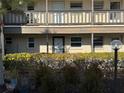Condo building exterior with balconies and landscaping at 4555 Marine Pkwy # 103, New Port Richey, FL 34652