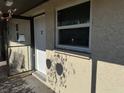 Condo building exterior with entrance and landscaping at 4555 Marine Pkwy # 103, New Port Richey, FL 34652