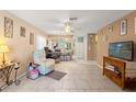 Bright living room, tiled floors, open to kitchen at 6225 Emerson Dr, New Port Richey, FL 34653