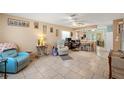 Spacious living room with tiled floors and comfortable seating at 6225 Emerson Dr, New Port Richey, FL 34653