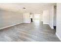 Spacious living area featuring light grey laminate flooring at 6834 Amarillo St, Port Richey, FL 34668