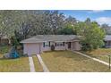 Exterior view of a single story home with a front yard at 7464 Acorn Cir, Spring Hill, FL 34606