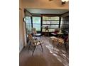 Bright sunroom with comfortable seating and view of backyard at 7635 Bloomingdale Dr, New Port Richey, FL 34654