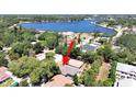 Aerial view of property highlighting its position near the lake at 807 Virginia Ave, Tarpon Springs, FL 34689