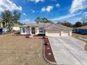 Spacious Primary bedroom with ample natural light and ceiling fan at 8284 Cockatoo Rd, Weeki Wachee, FL 34613