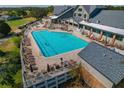 Large community pool with ample lounge seating and golf course views at 11744 Wheatfield Loop, Hudson, FL 34667