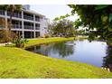 Condo building near pond with lush landscaping at 2164 Vista Del Sol Cir # 505, Lutz, FL 33558