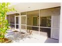 Screened-in porch with patio furniture and entrance at 2164 Vista Del Sol Cir # 505, Lutz, FL 33558
