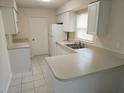 Efficient kitchen featuring white cabinets and ample counter space at 4500 Elwood Rd, Spring Hill, FL 34609